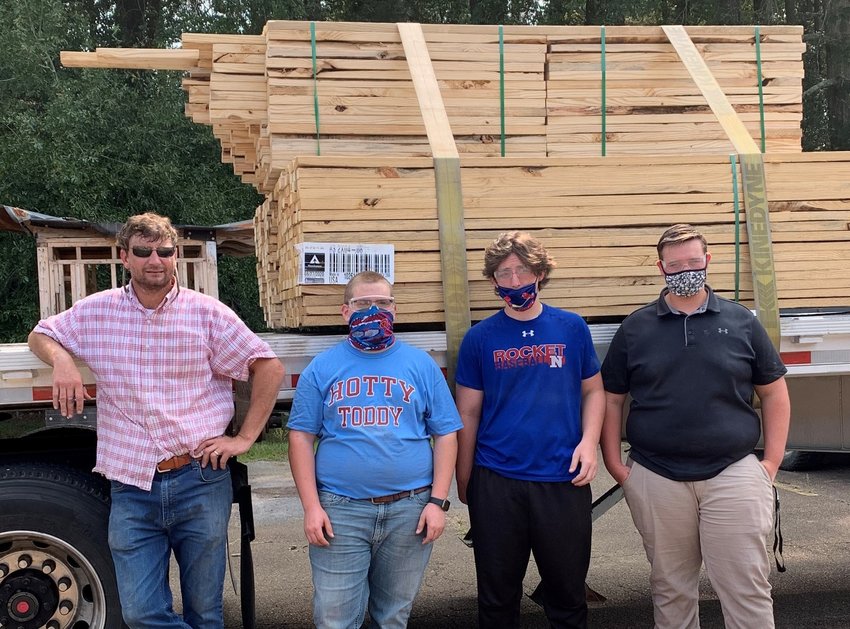Pictured are, from left, Cassidy Byars, construction teacher, and students Rory Renfrow, Peyton McGuirt and Chandler Sanderson.